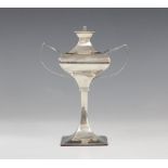 A George V silver table lighter by Charles Boyton & Son Ltd, London 1912, of faceted form on tapered