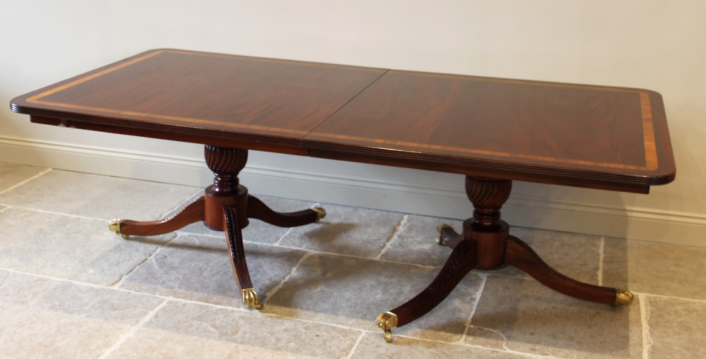 A Regency style twin pillar mahogany dining table, late 20th century, the rectangular satinwood - Image 3 of 6