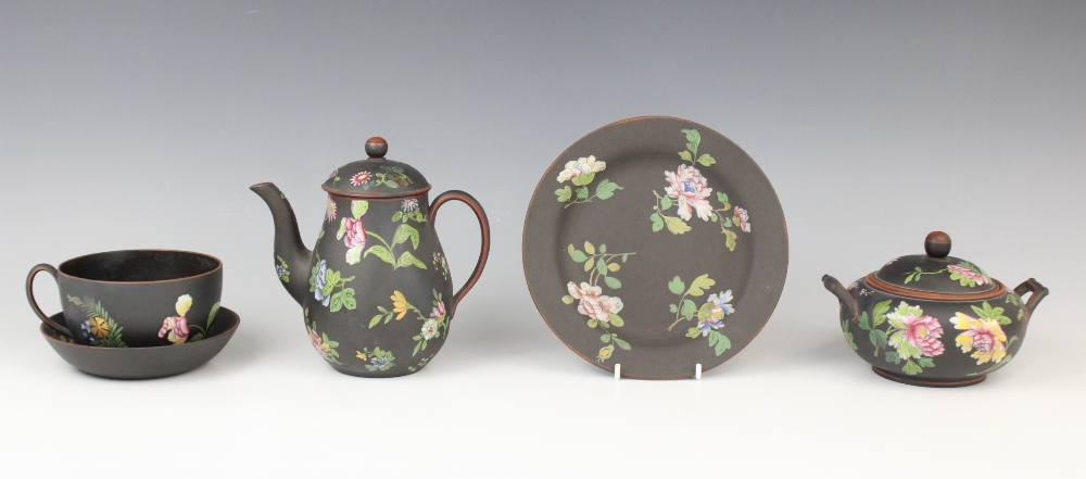 A selection of Wedgwood black basalt tea wares decorated in the 'Chinese Flowers' pattern, 19th