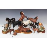 A Beswick Appaloosa stallion, 20cm high, with a collection of Royal Doulton horses, to include '