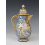 An Italian faience ewer and cover in the manner of Cantagalli, 20th century, decorated with a