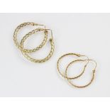 A pair of 9ct gold hoop earrings, each of circular form with a pierced design frame, hinged back