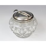 A George V cut glass sugar bowl and silver cover, marks for W Coulthard Ltd, Birmingham 1931, the