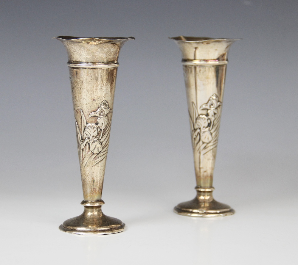 A pair of Art Nouveau silver posy vases by William Comyns, London 1907, each of tapering form with