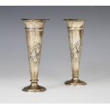 A pair of Art Nouveau silver posy vases by William Comyns, London 1907, each of tapering form with