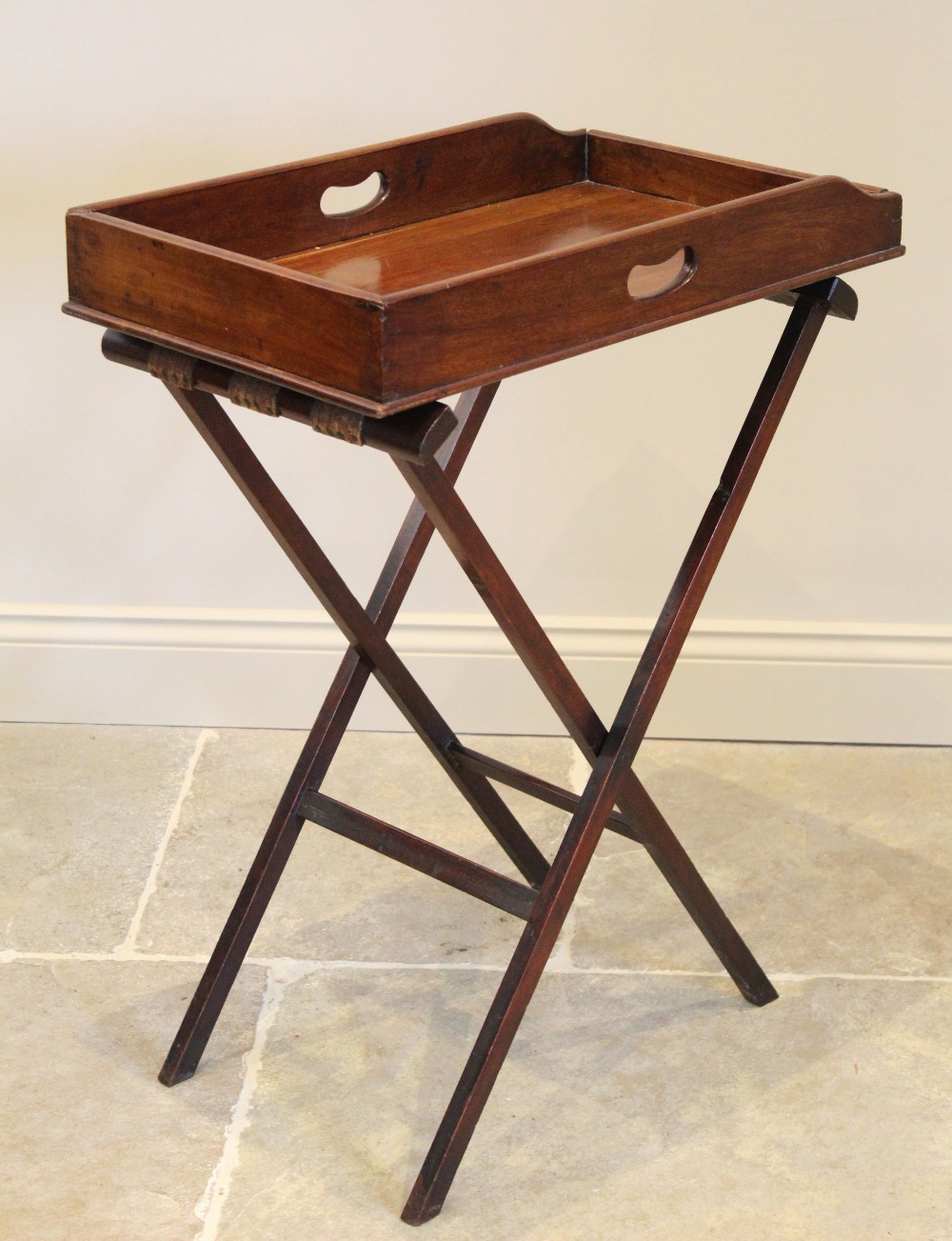 A 19th century mahogany butlers tray, the rectangular galleried tray with side handle apertures,