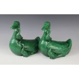 A pair of Chinese porcelain green glazed ducks, early 20th century, each modelled with two