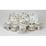 A Wedgwood part dinner service in the 'Wild Strawberry' pattern, comprising: twelve dinner plates,