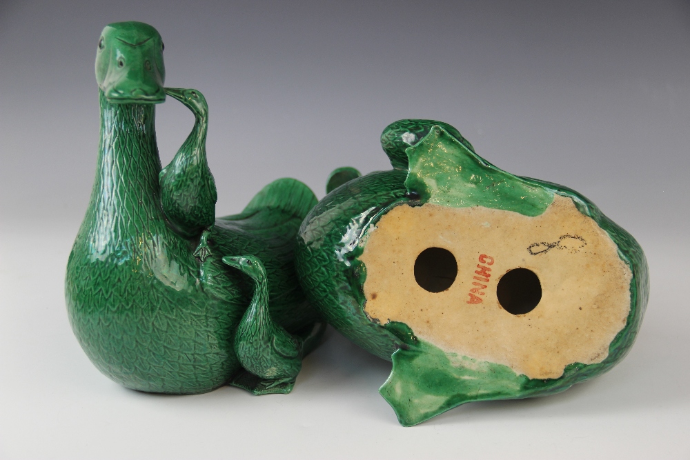 A pair of Chinese porcelain green glazed ducks, early 20th century, each modelled with two - Image 4 of 4