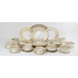 A Wedgwood 'Gold Florentine' part dinner service, W4219, comprising: a meat plate, twelve dinner