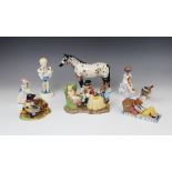 A Beswick 'The Mad Hatter's Tea Party' figural group, with a Royal Doulton Wind In The Willows