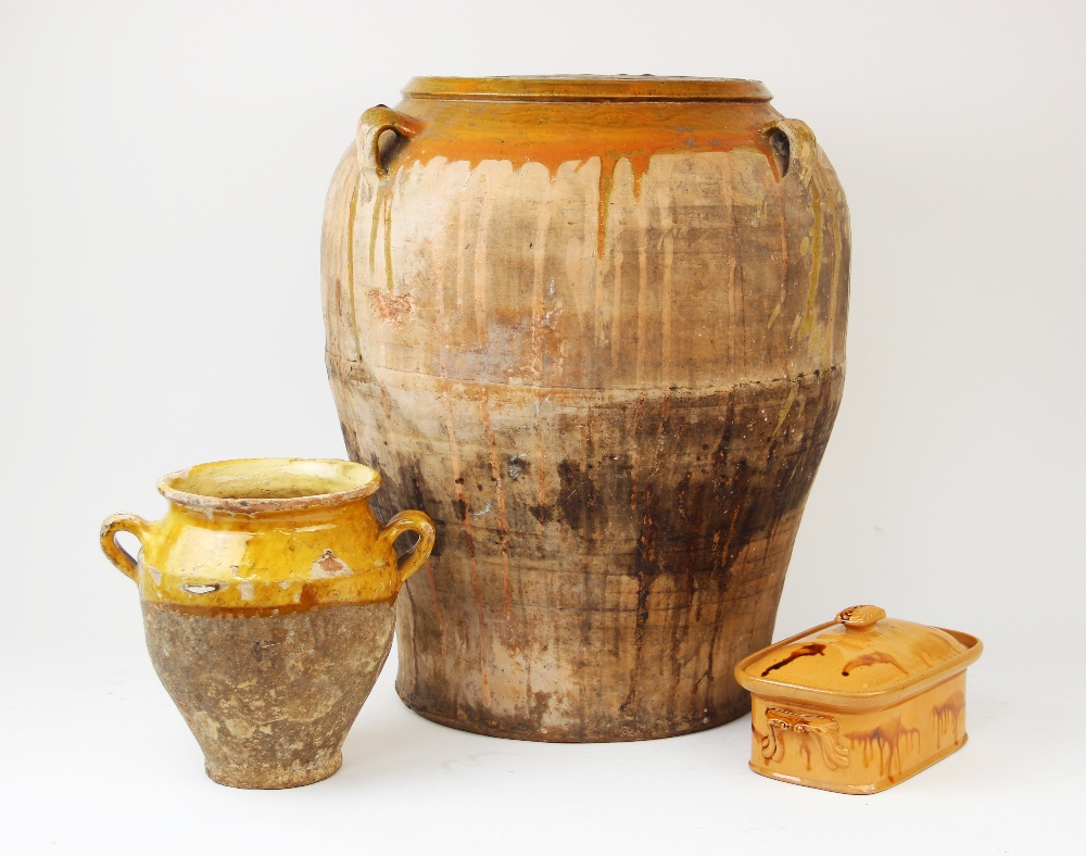 A terracotta olive oil jar of large proportions, of baluster form with three loop handles and