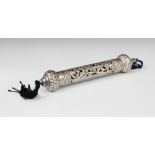 An Indian white metal scroll holder, of cylindrical form with pierced and embossed scrolling foliate
