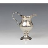 A George III silver cream jug, marks for George Smith (II), London 1778, of baluster form on domed