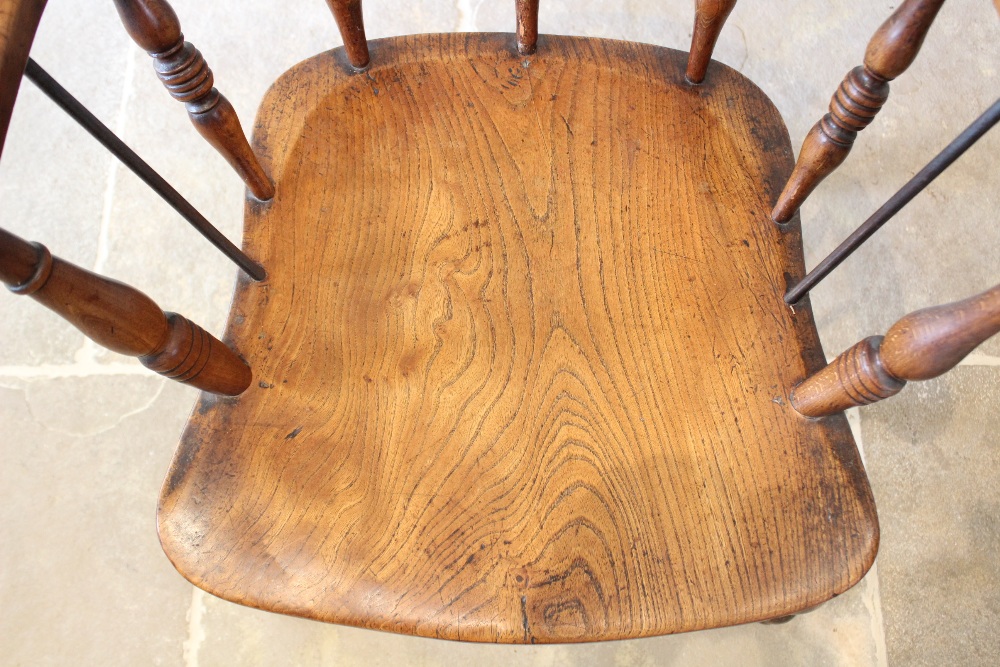 A late 19th century elm and beech smokers bow elbow chair, the 'C' shaped top rail raised upon - Image 3 of 3