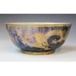 A Wedgwood 'Dragon' lustre bowl, early 20th century, decorated with gilt highlighted dragons and
