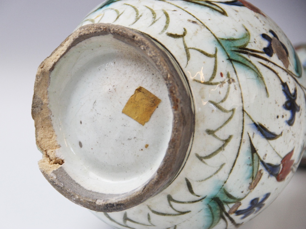 An Ottoman Empire Turkish polychrome pottery jug, of pear shape with attached handle and flared - Image 9 of 9