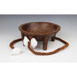 A Polynesian Fiji kava bowl with attached coconut fibre sennit cord and cowrie shells, 26.5cm