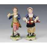 A pair of 18th century Derby musician figures, one modelled as a flautist, the other as a lutist,