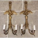 A pair of 19th century gilt wood and gesso pendant wall sconces, each with a rams mask terminal