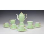 A Wedgwood apple green six setting coffee service, early 20th century, comprising: six coffee