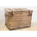 An early 20th century wicker laundry basket by Pearson & Son, Nottingham, the hinged cover with