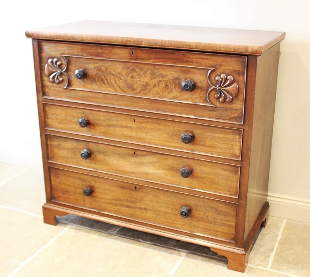 A mid 19th century mahogany secretaire chest of drawers, the fall front top drawer applied with