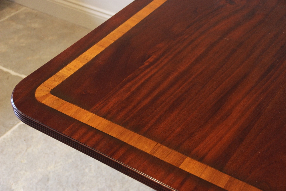 A Regency style twin pillar mahogany dining table, late 20th century, the rectangular satinwood - Image 4 of 6