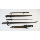 A collection of bayonets, to include a World War I period German issue rifle bayonet, probably by