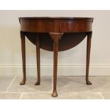 A mid 18th century mahogany folding tea table, the demi-lune folding top above two hinged drawers,