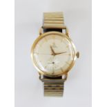 A Gentleman's vintage Omega Automatic 14ct gold wristwatch, the round champagne dial with tapered