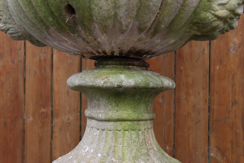 A reconstituted stone campana garden urn, of typical lobed form, moulded in relief with scrolling - Image 5 of 6
