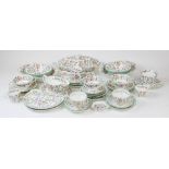 A Minton 'Haddon Hall' pattern part dinner service, comprising: an oval serving dish and cover,