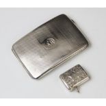 A George V silver cigarette case by Charles S Green & Co Ltd, Birmingham 1919, of rounded