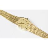 A lady's vintage 18ct gold Ebel wristwatch, the gold-toned dial with black and gold baton markers,
