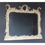 A 19th century Florentine painted and scroll framed over mantel mirror with polychrome highlights,