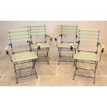 A set of four French style folding bistro chairs, mid 20th century, each chair with a painted