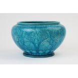 A Burmantofts Faience jardiniere, model 118, the turquoise body with incised foliate motifs and