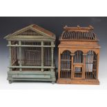 A painted wood and wire work architectural bird cage, 20th century, the triangular gable and twin