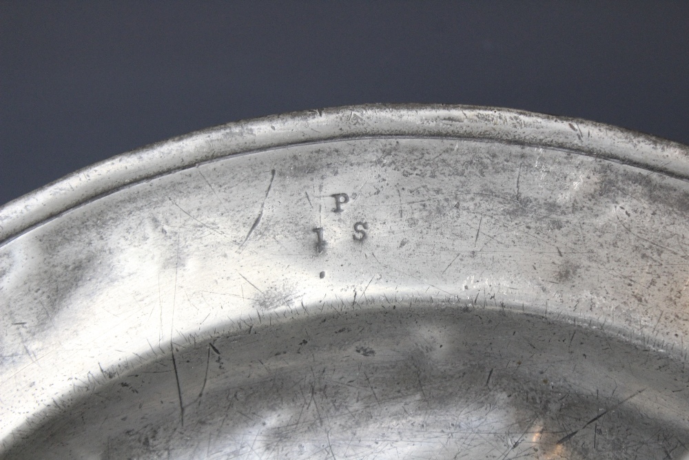 A pewter charger, of typical form with 'I P S' stamped to the rim, probably made by W. Cooke, - Image 3 of 4