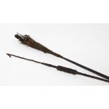 A Naga Tribe spear, 19th century, with barbed iron terminal and carved figural shaft with dyed