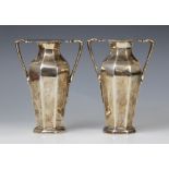 A pair of Edwardian silver twin-handled vases by Goldsmiths & Silversmiths Company, London 1909,