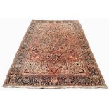 A large Persian Tabriz wool carpet, the central floral medallion engulfed with formal foliate