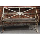 An early 19th century painted iron garden bench, the rail back centred with a cast Lancashire rose