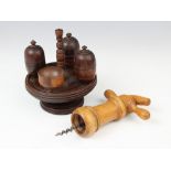 A ring turned walnut cruet set, 19th century, the footed stand with turned bobbin handle and four