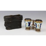 A pair of French opera glasses by Chevalier of Paris, 19th century, the porcelain barrels hand