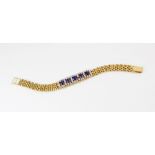 A sapphire and diamond bracelet, comprising five untested oval mixed cut sapphires, (measuring