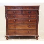 A mid 19th century mahogany chest of drawers, the secret frieze drawer above two short and four long
