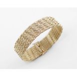 A 9ct integral-link bracelet, the textured woven-link strap with sliding clasp and safety