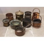 A collection of country house brass and copper wares, to include copper coal helmet, brass jam pans,
